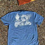 Blue t-shirt with a white graphic design on a textured surface