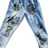 Grey sweatpants with black skull and crossbones designs