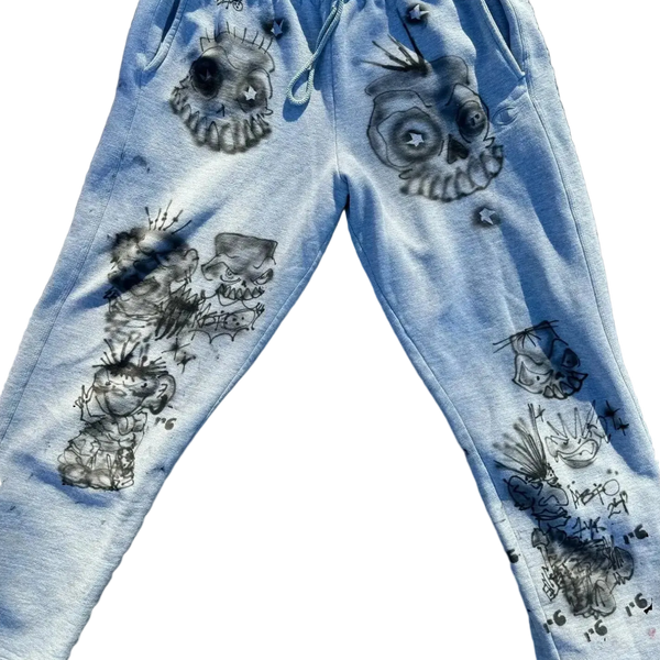 Grey sweatpants with black skull and crossbones designs