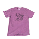 Purple t-shirt with a graphic design on a concrete surface