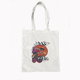 White tote bag with Halloween-themed design featuring a pumpkin and cats on a white background